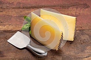 Two pieces of Manchego, queso manchego, cheese made in La Mancha region of Spain from the milk of sheep of the manchega breed