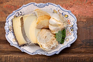 Two pieces of Manchego, queso manchego, cheese made in La Mancha region of Spain from the milk of sheep of the manchega breed photo