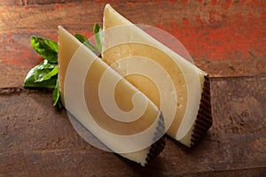 Two pieces of Manchego, queso manchego, cheese made in La Mancha photo