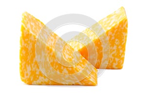 Two pieces of marbled cheese