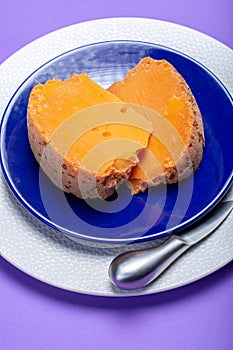 Two pieces of native French aged cheese Mimolette, produced in L