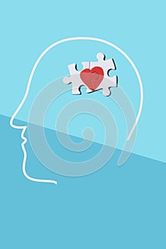 Puzzle pieces forming a heart in the head of a man photo