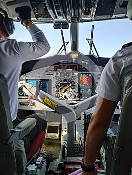 Two pilots in cockpit of airplane