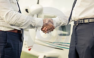 Two pilots shaking hands before flight