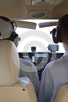 Two pilots in small airplane cocpit