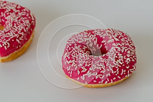 Two pink donut on white  background