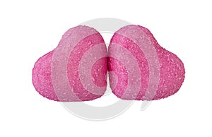 two pink sugar hearts on a white background close-up