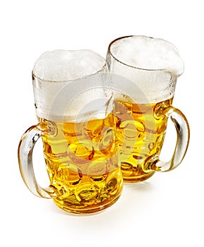 Two pint mugs of frothy cold beer