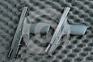 two pistols close-up. 9 millimeters. military weapon . pistol