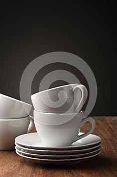 Two plain white pottery tea or coffee cups