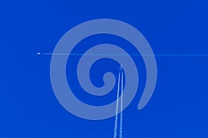 Two planes flying against a sky