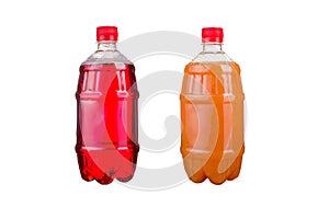 Two plastic bottles with colorful natural juices. Isolated