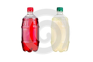 Two plastic bottles with colorful natural juices. Isolated