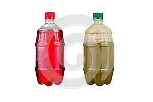 Two plastic bottles with colorful natural juices. Isolated