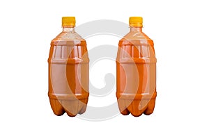 Two plastic bottles with colorful natural juices. Isolated