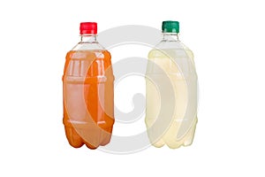 Two plastic bottles with colorful natural juices. Isolated