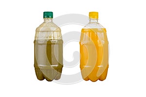 Two plastic bottles with colorful natural juices. Isolated