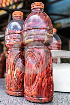 Two plastic bottles filled with red carrots in Manila, Philippines photo