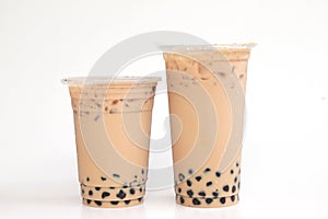 Two plastic glass Taiwan ice milk tea with boba bubble