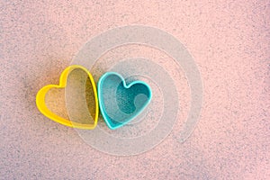 Two plastic hearts together, the color of the Ukrainian flag, blue and yellow. Blank with place for your text