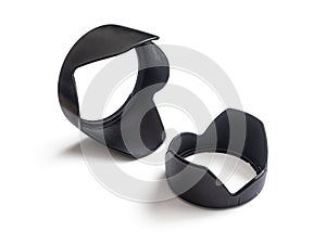 Two plastic lens hoods to protect against the ingress of extraneous light into the camera lenses