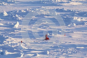 Two polar scientists working on an ice floe