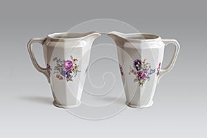 Two porcelain Creamer vessel on a light background