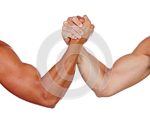 Two powerful men arm wrestling