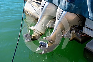 Two powerful outboard engines on the boat. Propeller from outboard motor out of the water