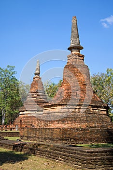 Two prangs on the ruins of the ancient Buddhist temple Wat Phra That. Kamphaeng Phet, Thailand