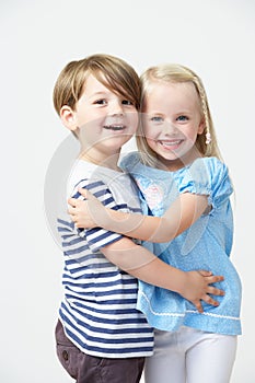 Two Pre School Pupils Hugging One Another