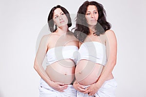 two pregnant dreamy women