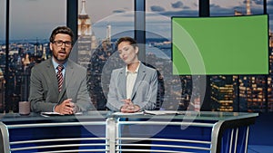 Two presenters broadcasting news at mockup television media channel closeup