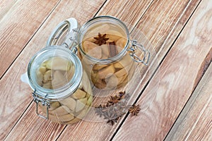 Two Preserved Pear Compote with Star Anise and Cinnamon in Glass