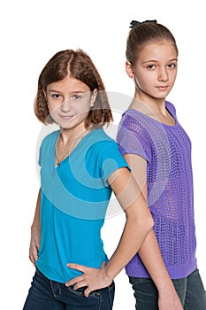 Two preteen girls against the white