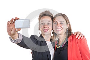 Two pretty teen girls taking selfies with her smart phone