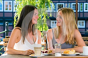 Two pretty women in cafe