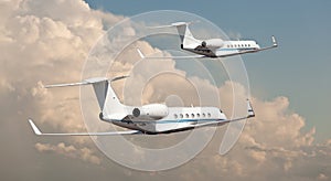 Two private jets flying side by side