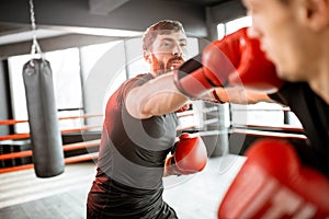 Two professional boxers fighting at the gym