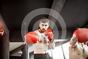 Two professional boxers training at the gym