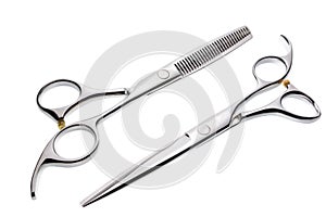 Two professional haircutting scissors isolated, with clipping path.