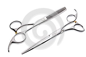 Two professional haircutting scissors isolated, with clipping path. photo