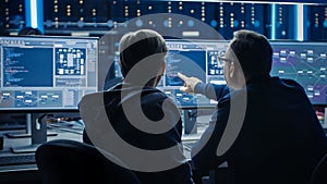 Two Professional IT Programers Discussing Blockchain Data Network Architecture Design and Developm