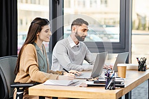 Two professionals sit at a table