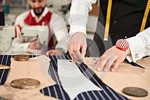 Two professionals working together in clothing atelier