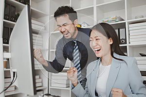 Two programmers looking at computer screen, programmer design custom computer programming, programming code and website. Computer