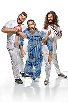 Two psychiatrists holding a lunatic