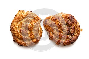 Two puff pastry pies with minced meat, on a white background