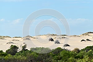 Two Quad bikes driving on sand dune near Kalbarri Western Australia