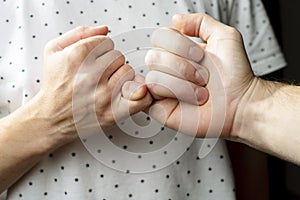 Two quarreling person reconciled and make pinky swear gesture